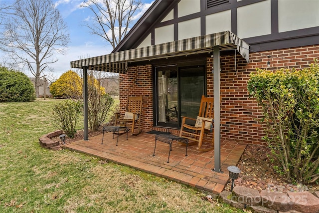 wooden terrace featuring a patio area and a yard