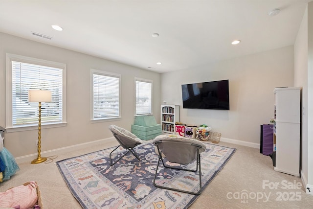 living room featuring carpet floors, recessed lighting, baseboards, and visible vents