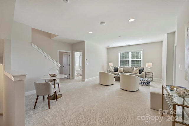 living room with light colored carpet, recessed lighting, baseboards, and stairs