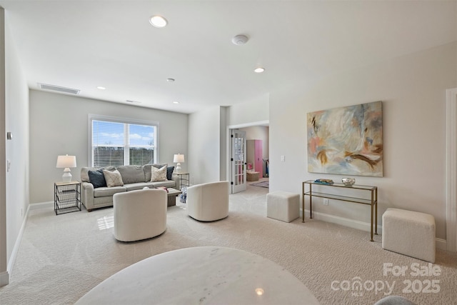 living area featuring recessed lighting, baseboards, visible vents, and carpet