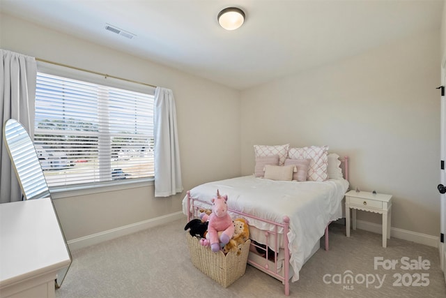 bedroom featuring baseboards, light colored carpet, and visible vents