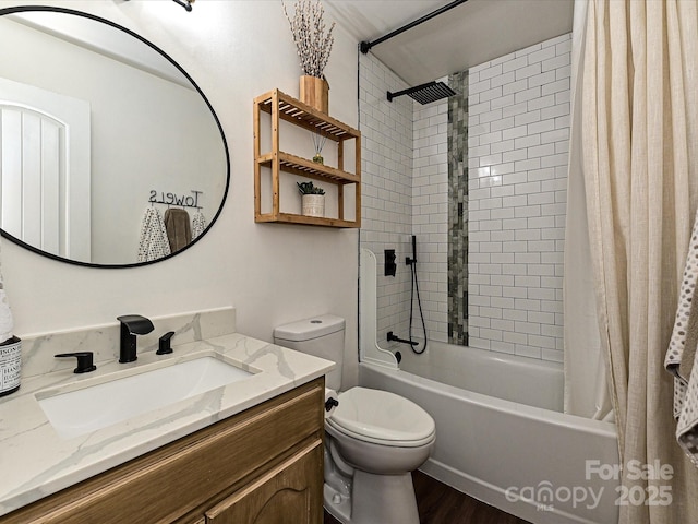 full bath featuring vanity, toilet, wood finished floors, and shower / tub combo