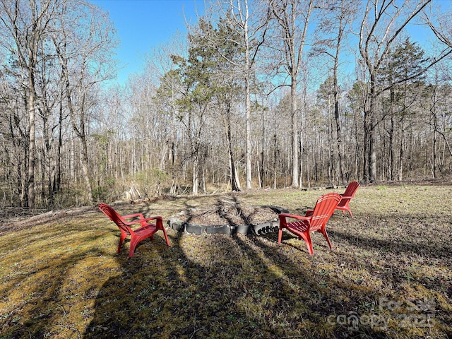 view of yard with a view of trees