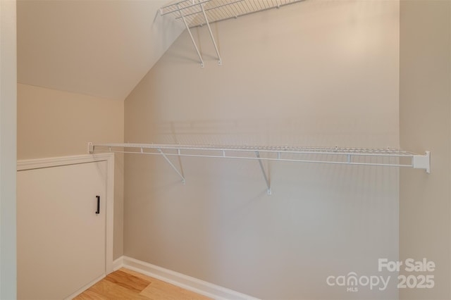 walk in closet featuring light wood-style floors