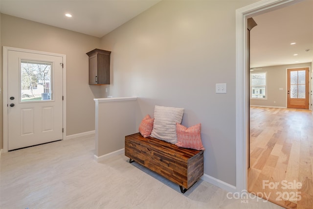 interior space featuring recessed lighting and baseboards