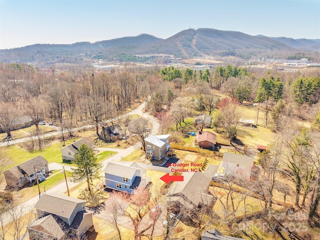 aerial view with a mountain view and a wooded view