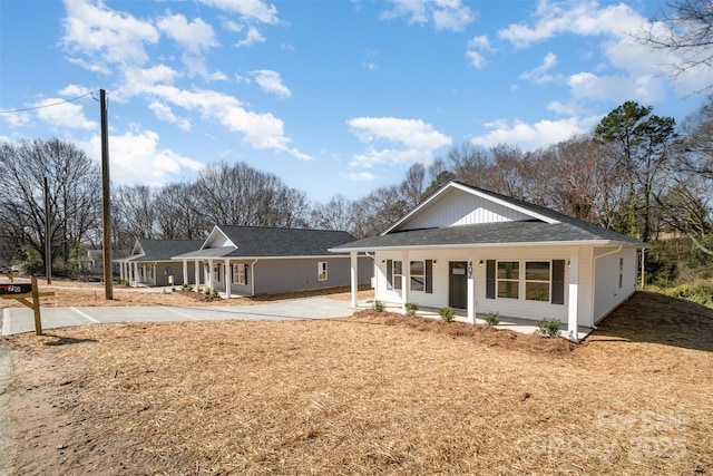 view of front of home featuring a porch and driveway