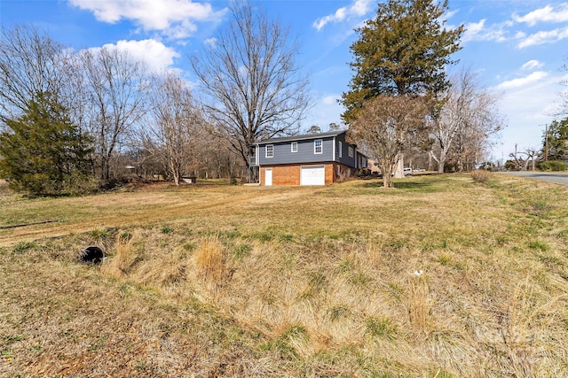 view of yard featuring an attached garage