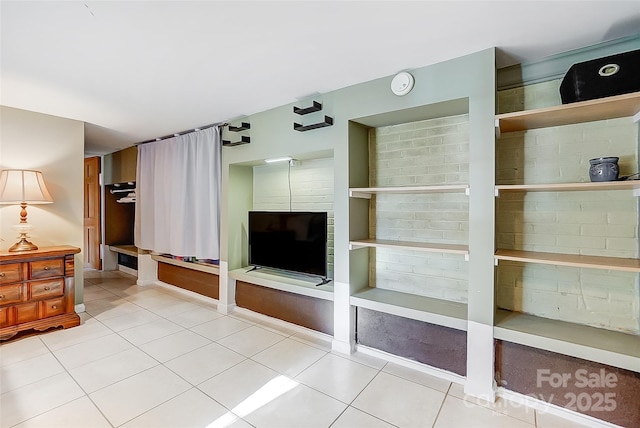 unfurnished living room featuring tile patterned floors