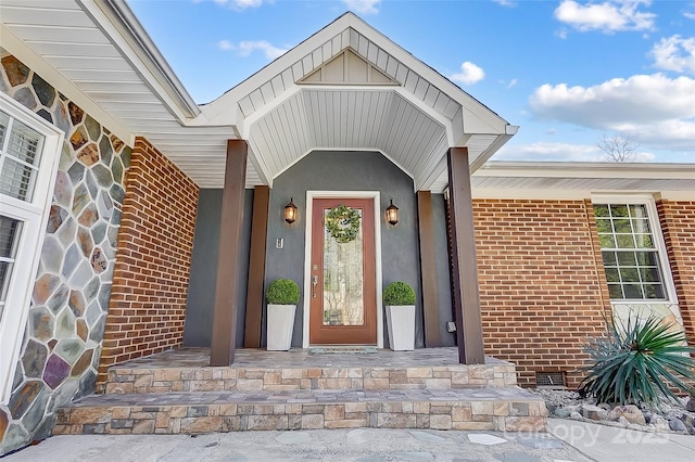 entrance to property with crawl space and brick siding