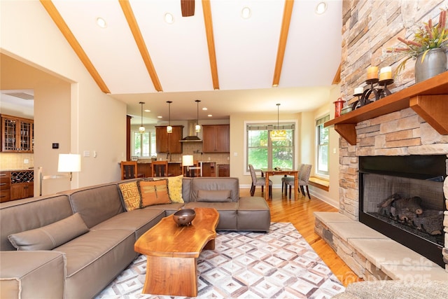 39 Hawks Pointe Ln, Weaverville, NC 28787 - living room featuring light wood-style flooring, high vaulted ceiling, a fireplace, and beamed ceiling