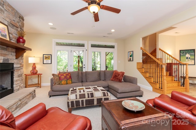 39 Hawks Pointe Ln, Weaverville, NC 28787 - living area featuring baseboards, a stone fireplace, stairs, ceiling fan, and recessed lighting