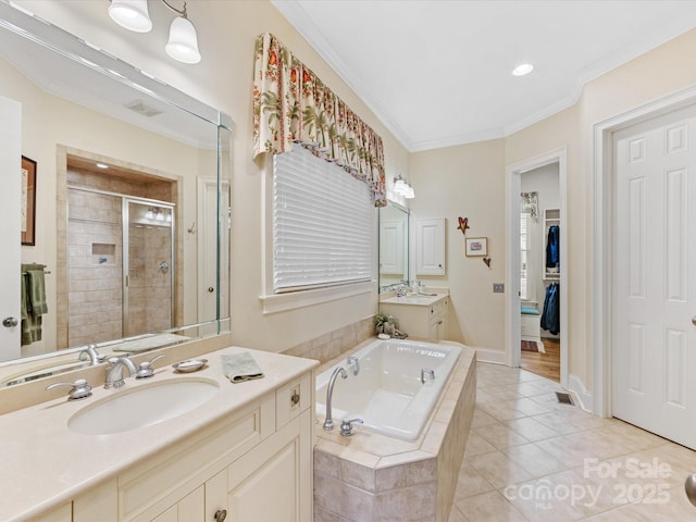 full bathroom featuring crown molding, a stall shower, a sink, a bath, and tile patterned floors