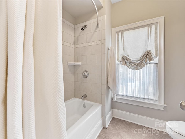 bathroom featuring shower / bathtub combination with curtain, baseboards, and tile patterned floors