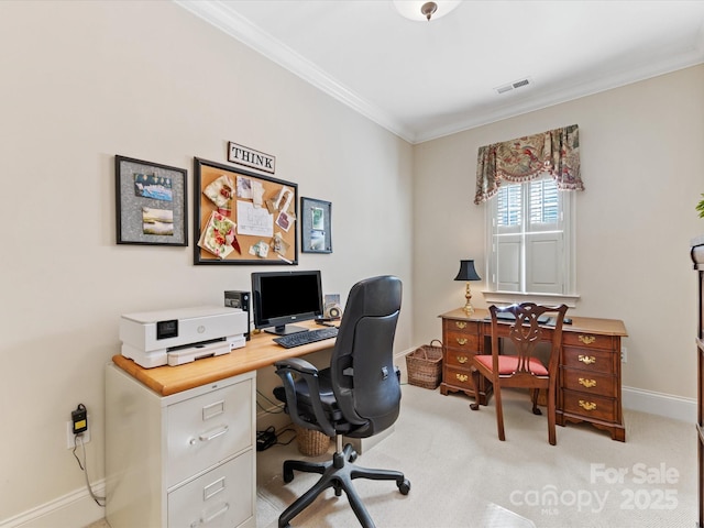 office with visible vents, crown molding, light carpet, and baseboards