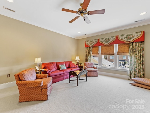 carpeted living area with ornamental molding, recessed lighting, visible vents, and baseboards