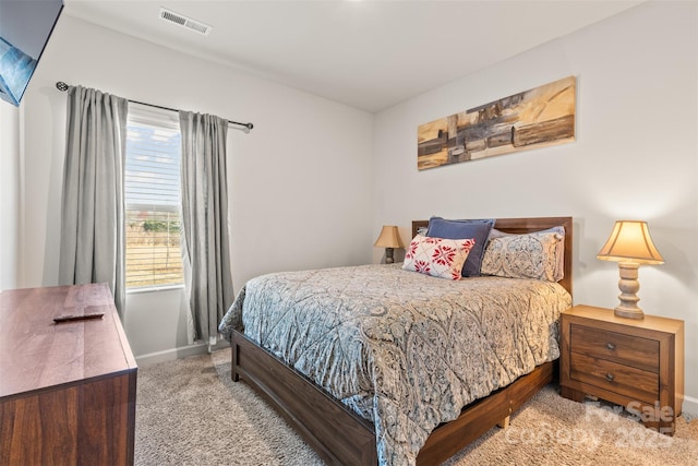 bedroom featuring carpet, visible vents, and baseboards