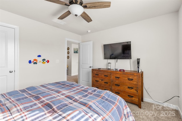 carpeted bedroom with visible vents, baseboards, and ceiling fan