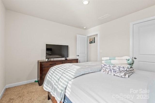 bedroom featuring carpet flooring and baseboards