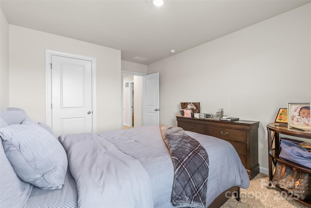 bedroom featuring light colored carpet