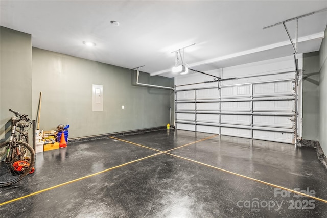 garage with electric panel and a garage door opener