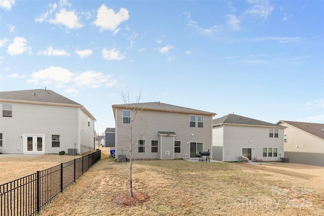 back of house with a patio, central air condition unit, french doors, and fence