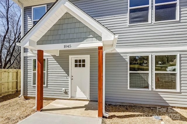 doorway to property with fence