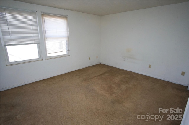 unfurnished room with carpet floors