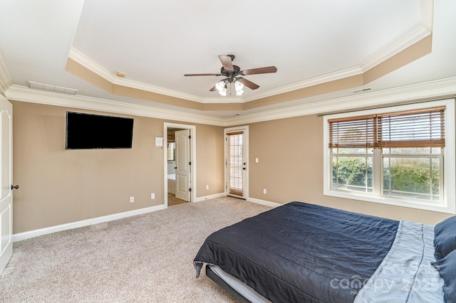 carpeted bedroom featuring a raised ceiling, visible vents, crown molding, and baseboards