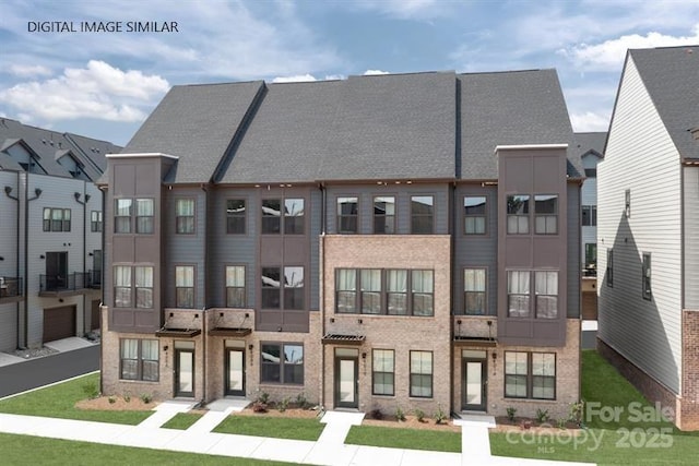 view of front of property featuring brick siding