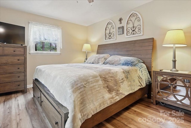 bedroom with wood finished floors