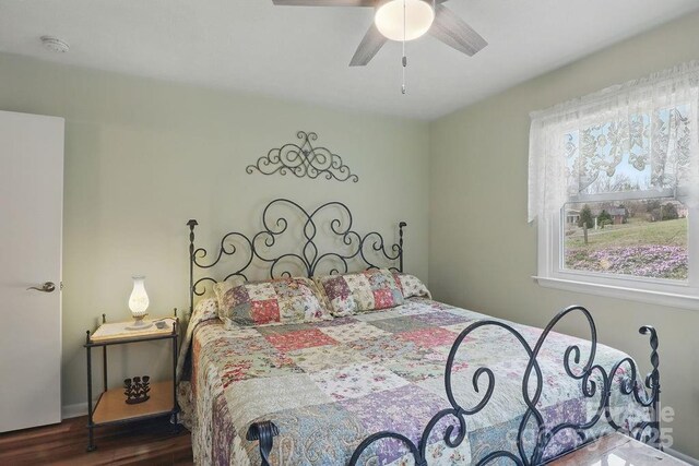 bedroom with wood finished floors and ceiling fan