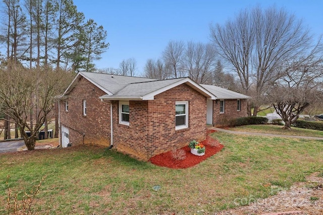 view of home's exterior featuring a yard and brick siding