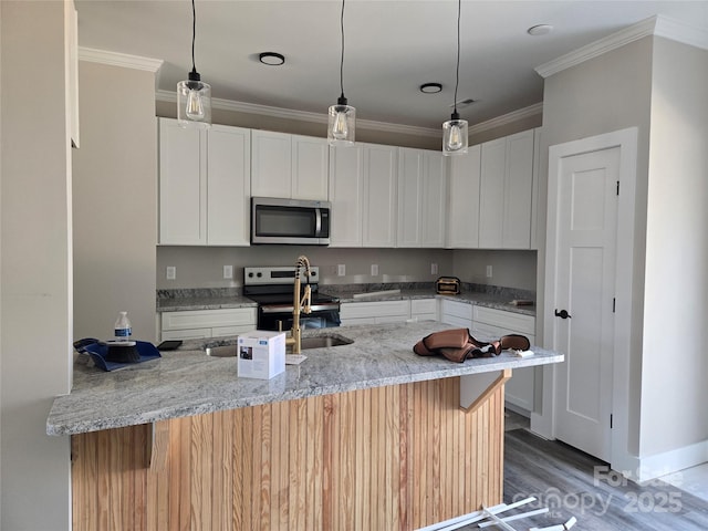 kitchen featuring light wood-style flooring, stainless steel appliances, white cabinetry, ornamental molding, and light stone countertops