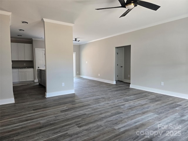 unfurnished living room with crown molding, dark wood-style floors, a ceiling fan, and baseboards