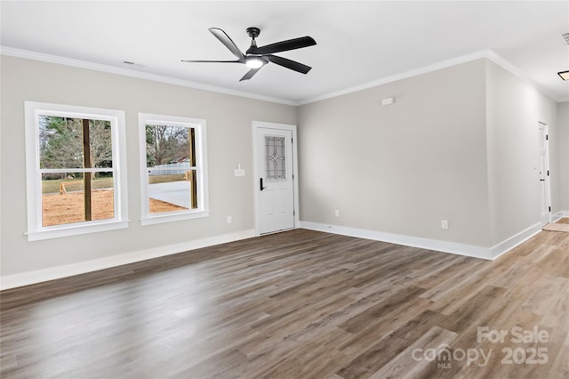 unfurnished living room featuring wood finished floors, visible vents, baseboards, ceiling fan, and crown molding