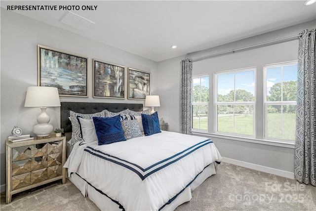 carpeted bedroom featuring recessed lighting and baseboards