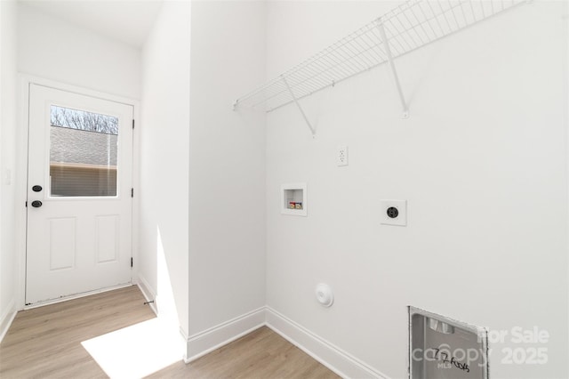 laundry area featuring hookup for a washing machine, laundry area, hookup for an electric dryer, and light wood-style flooring