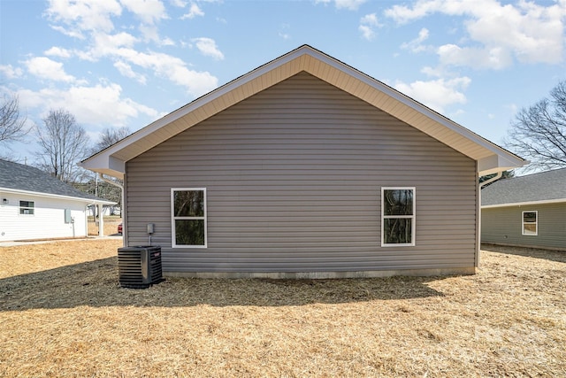 view of side of property featuring central AC