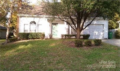 ranch-style home featuring a front yard