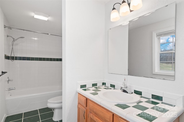 full bath with tile patterned floors, toilet, an inviting chandelier, shower / bath combination, and vanity