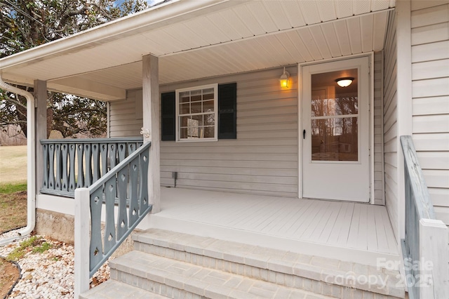 entrance to property featuring covered porch