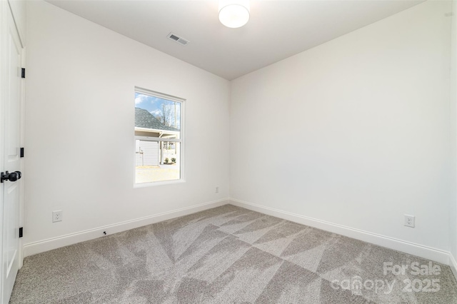 empty room featuring light carpet, baseboards, and visible vents