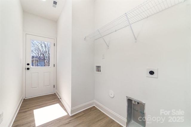 clothes washing area with hookup for a washing machine, laundry area, hookup for an electric dryer, and light wood-style flooring