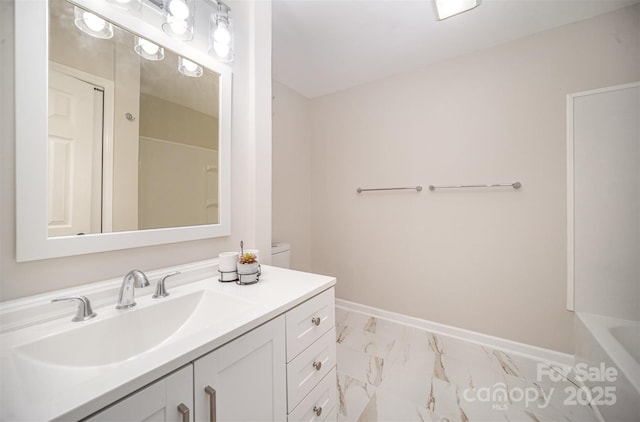 full bathroom with marble finish floor, vanity, and baseboards