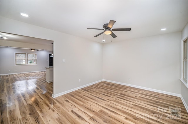 spare room featuring baseboards, ceiling fan, recessed lighting, and light wood-style floors