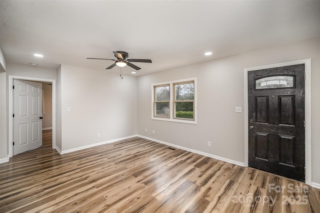 foyer featuring light wood-style flooring, baseboards, a ceiling fan, and recessed lighting