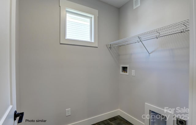 washroom featuring laundry area, baseboards, hookup for a washing machine, and visible vents