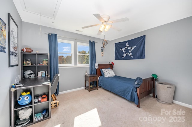 carpeted bedroom with visible vents, ceiling fan, attic access, and baseboards