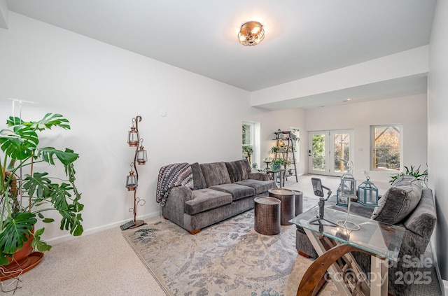 living room with carpet, french doors, and baseboards